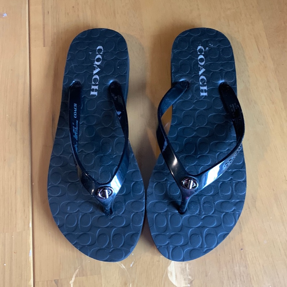 Coach black flip flops. NEVER WORN.
